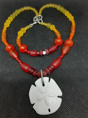 NB #117 Want to see a Sun Raise and Set? This one has a Sand dollar & Sea Beads.