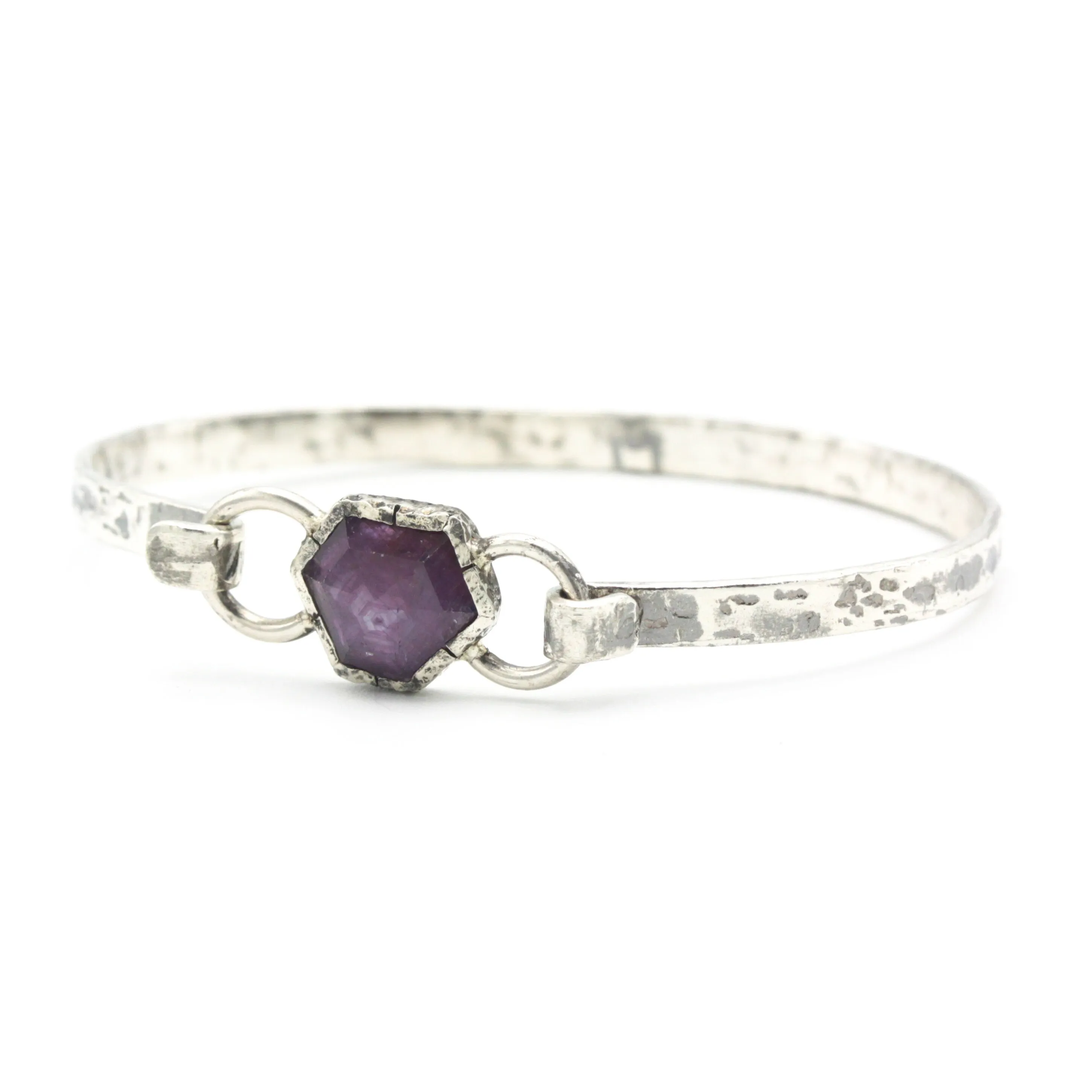 Pink sapphire bangle bracelet in silver bezel setting with oxidized sterling silver with texture band