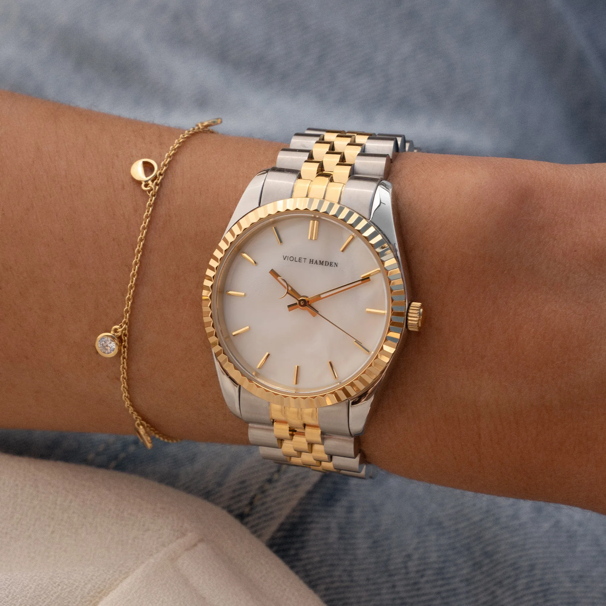 Sunrise round ladies watch gold and silver coloured and mother of pearl