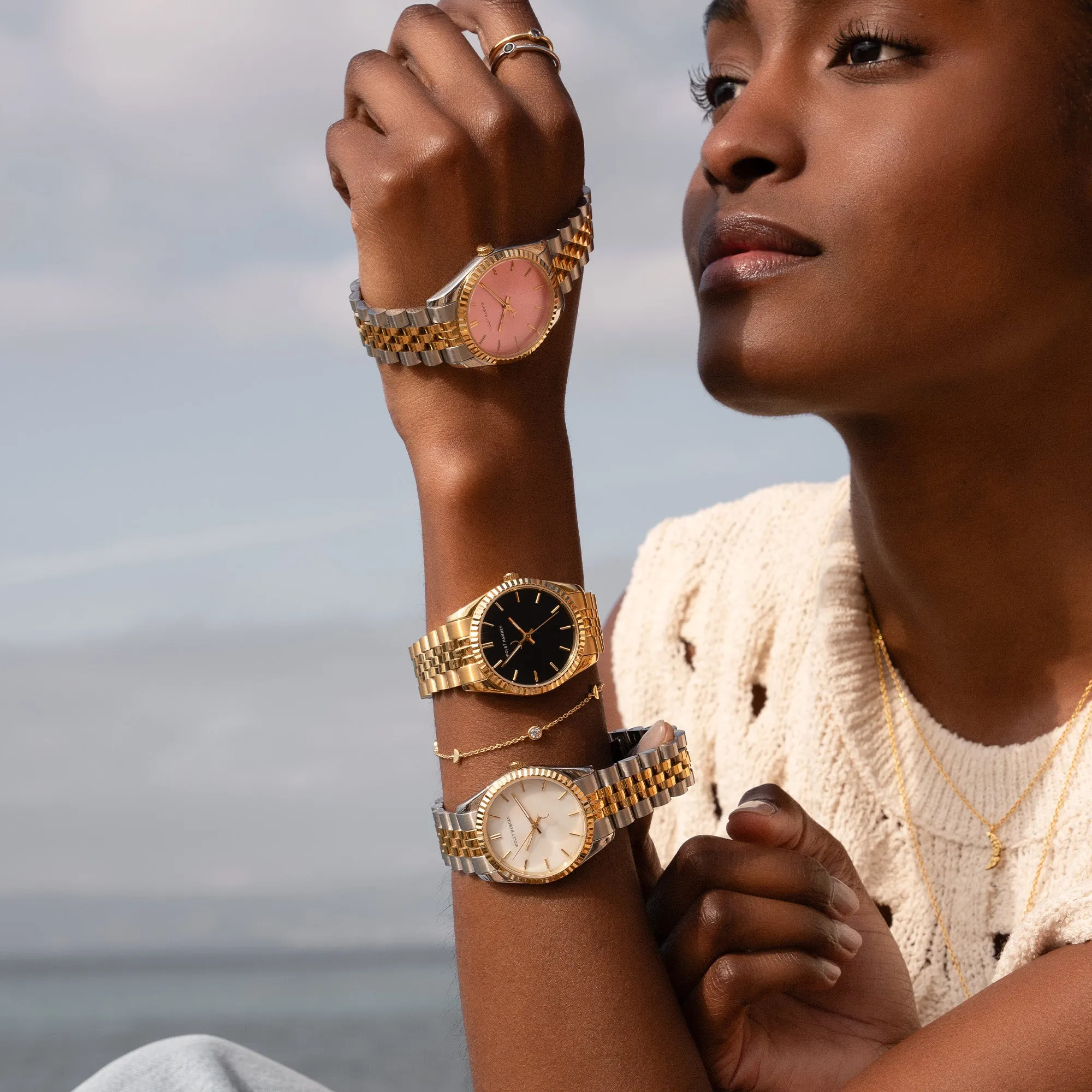 Sunrise round ladies watch gold coloured and black