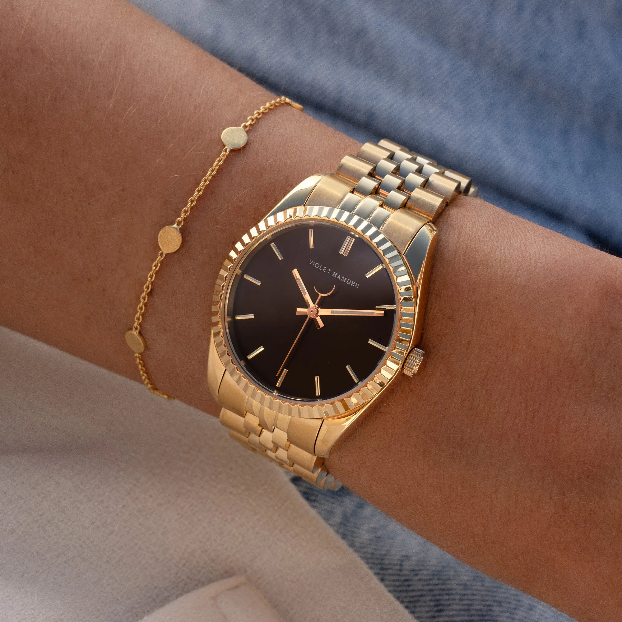 Sunrise round ladies watch gold coloured and black
