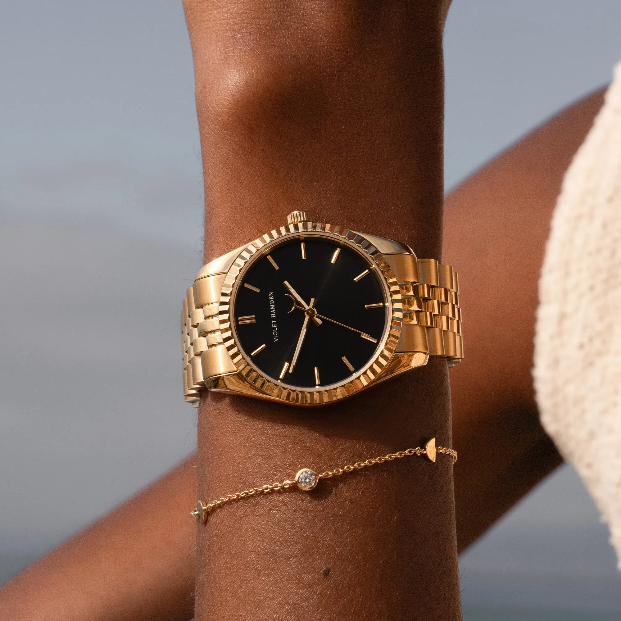 Sunrise round ladies watch gold coloured and black